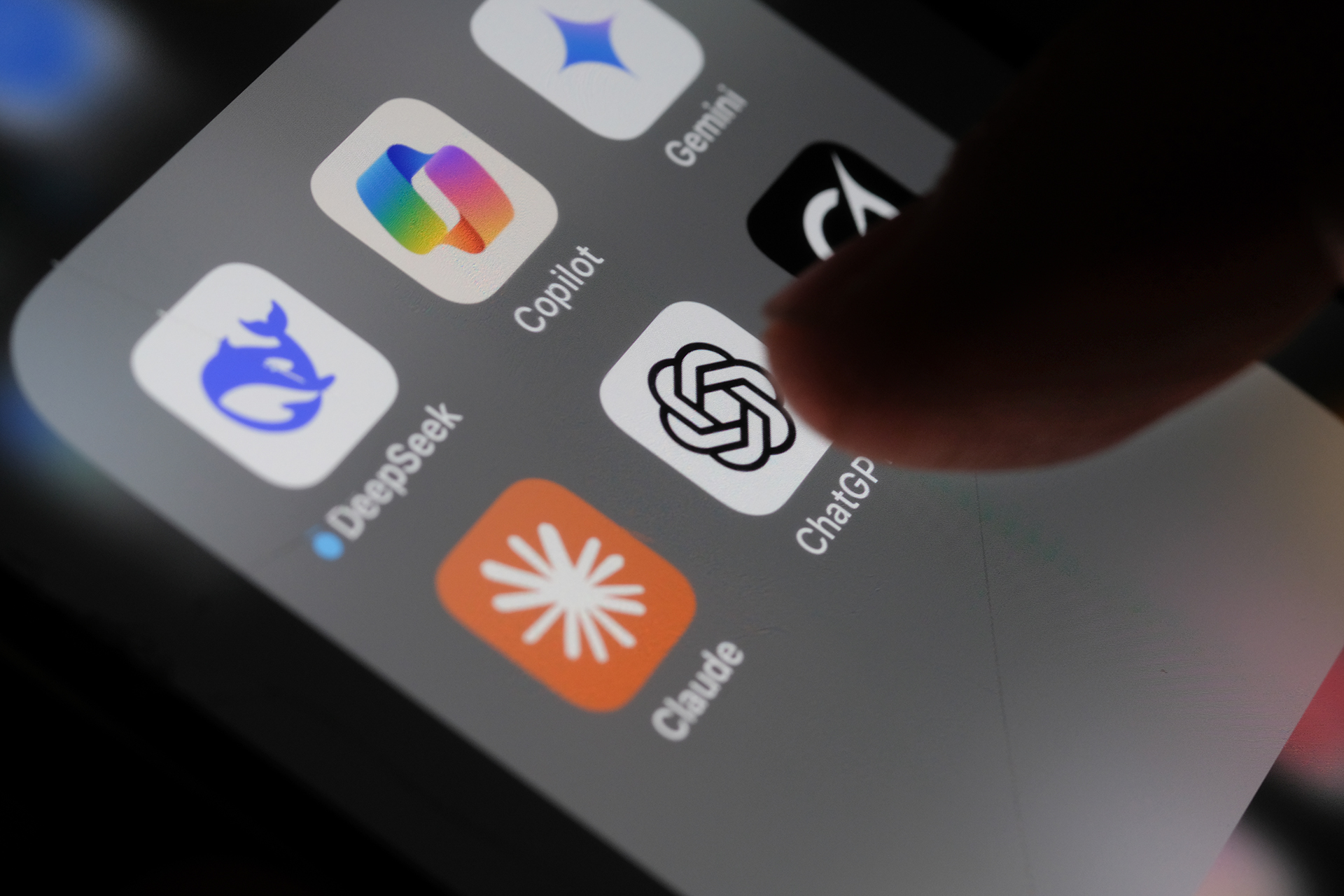 User taps on an AI app on cellphone.