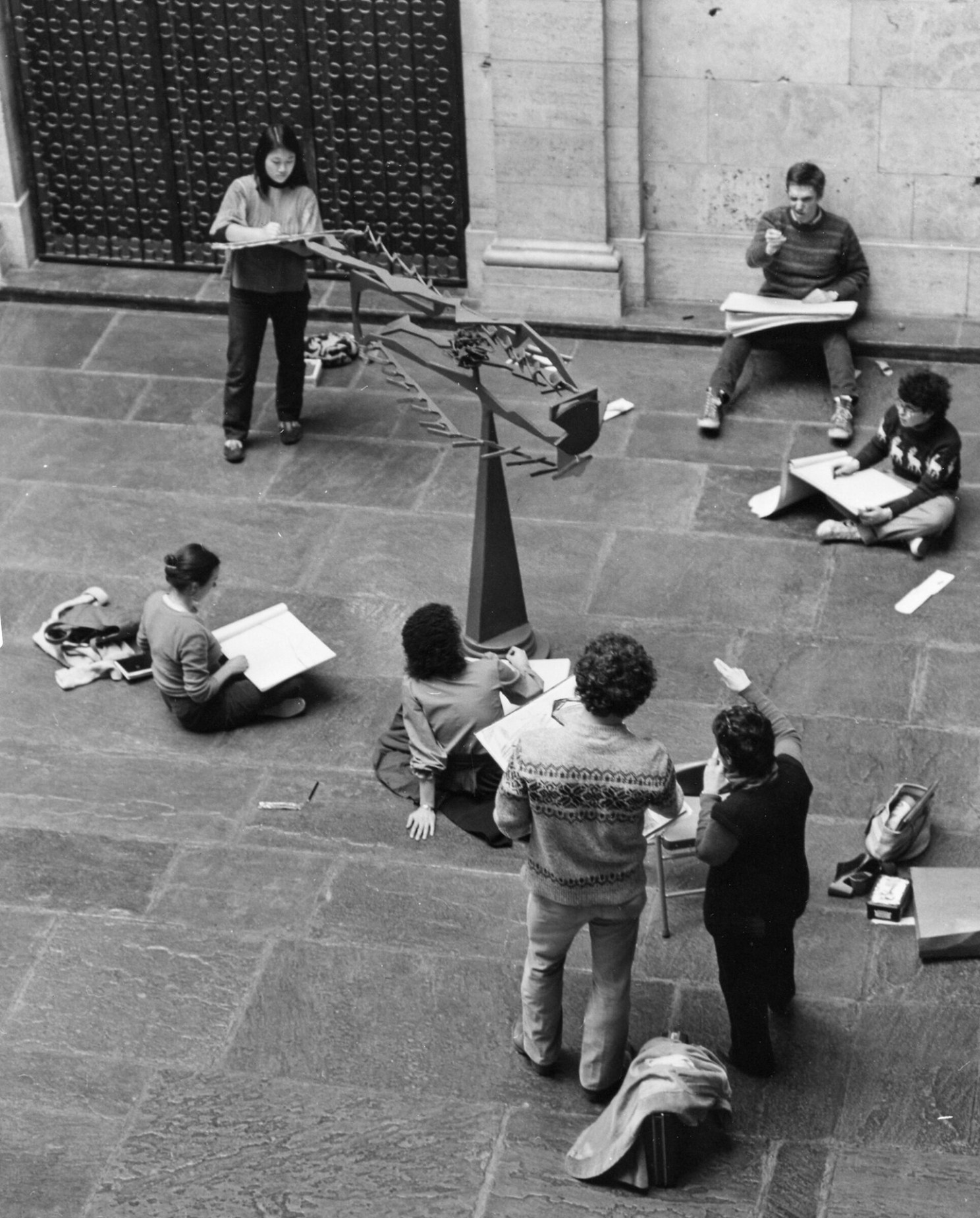 Students engage with David Smith’s sculpture “Fish.”