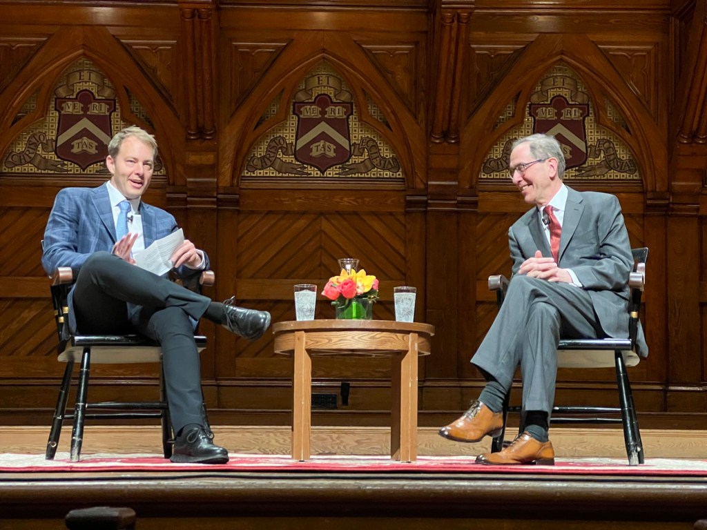 David Deming and Christopher Eisgruber.