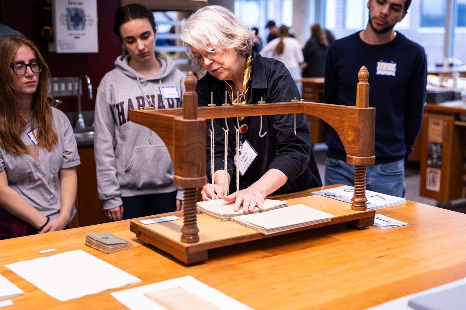 Book Conservator Amanda Hegarty shows how a sewing frame works.