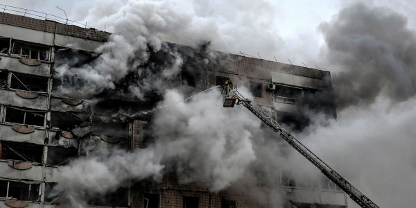 A firefighter uses an aerial ladder to suppress a fire in an apartment block hit by a Russian guided aerial bomb in Zaporizhzhia, Ukraine, on December 17, 2025.