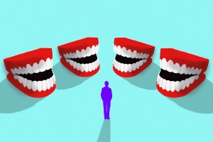 Man surrounded by laughing fake teeth.