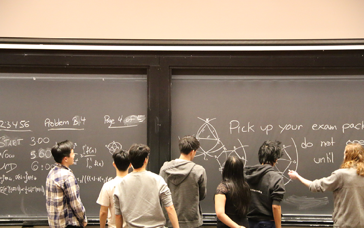 Students in front of the chalkboard