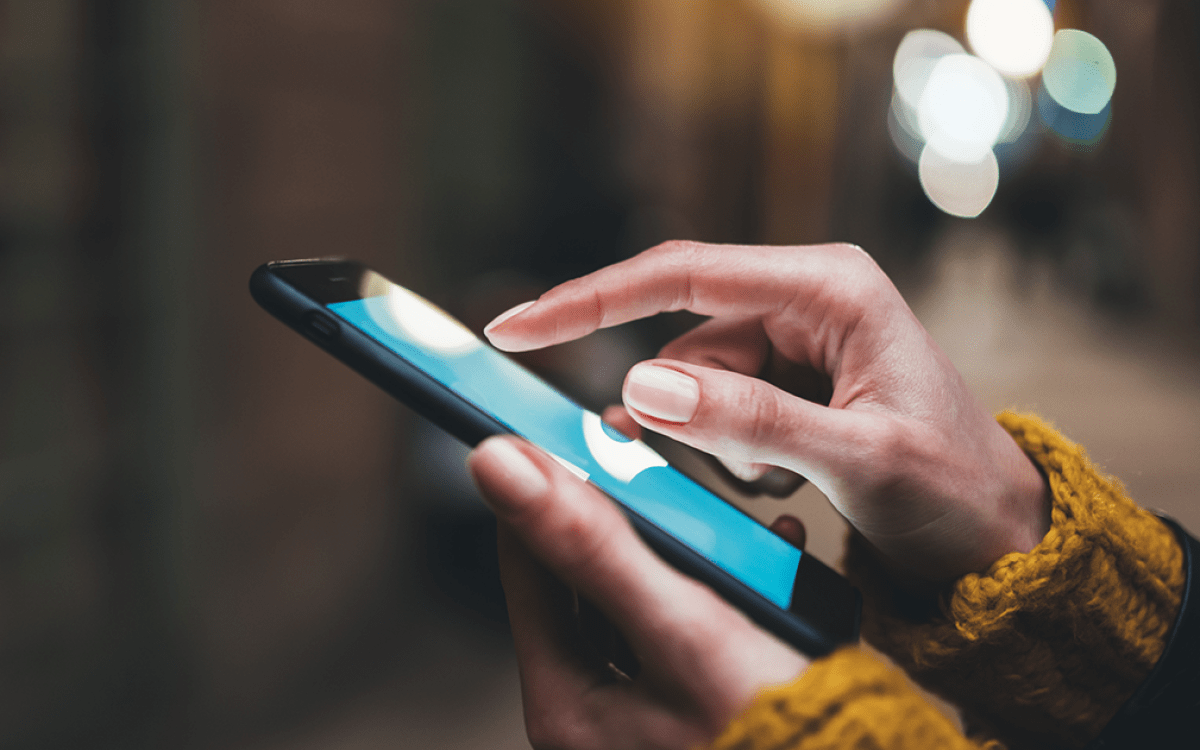 person scrolling on phone