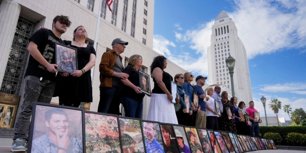 Parents of children who have died due alleged social media harms hold photos of their at the Los Angeles Superior Courthouse.