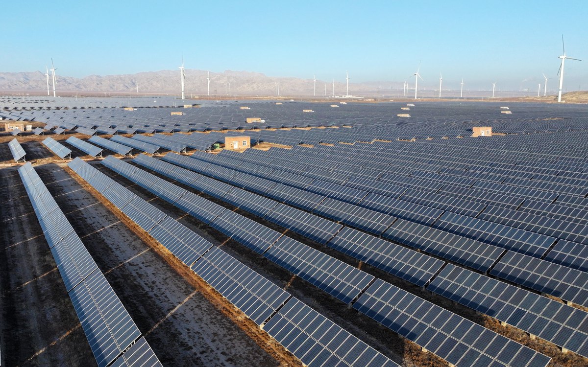 Wind turbines and photovoltaic panels are at a clean energy power plant at the foot of the Helan Mountains in Shizuishan City, Ningxia Hui Autonomous Region, China.