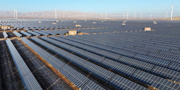 Wind turbines and photovoltaic panels are at a clean energy power plant at the foot of the Helan Mountains in Shizuishan City, Ningxia Hui Autonomous Region, China.