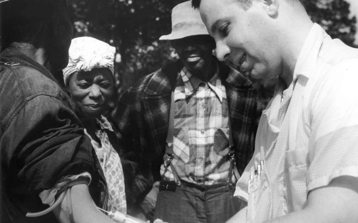 Doctor drawing blood from a patient as part of the Tuskegee Syphilis Study.