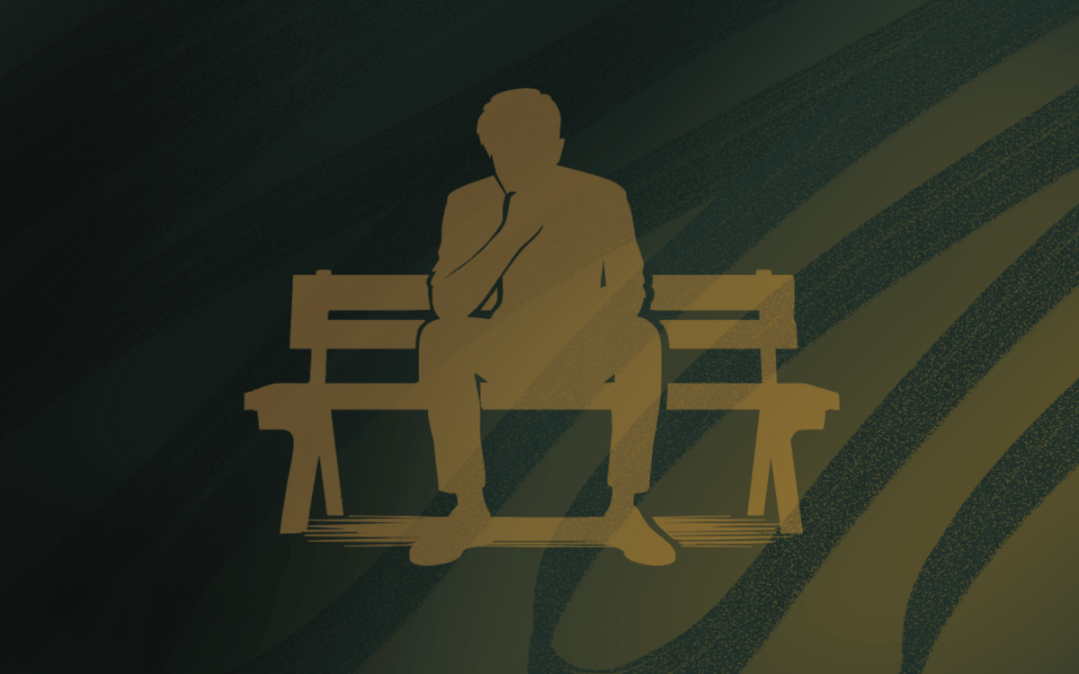person sitting on bench alone