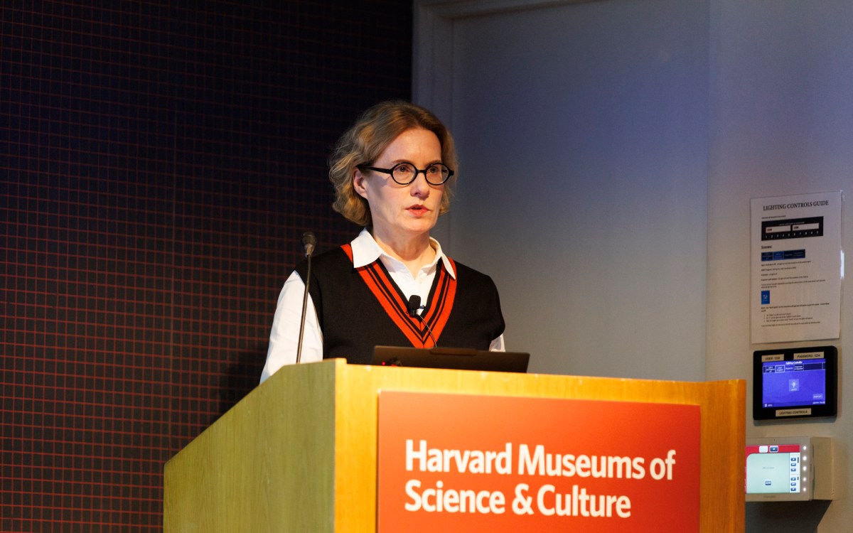 Joyce Chaplin at a podium.