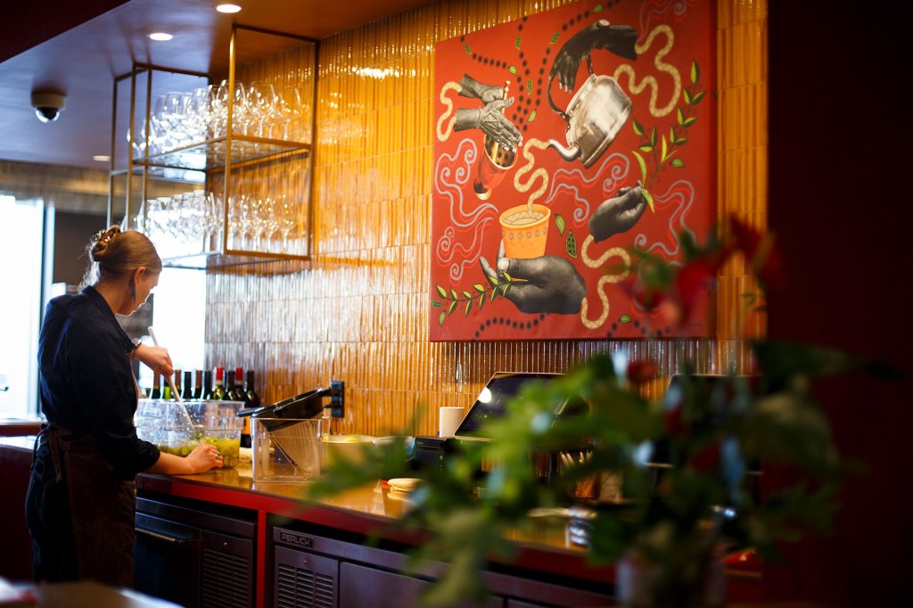 Custom paintings are displayed in Ama Restaurant.