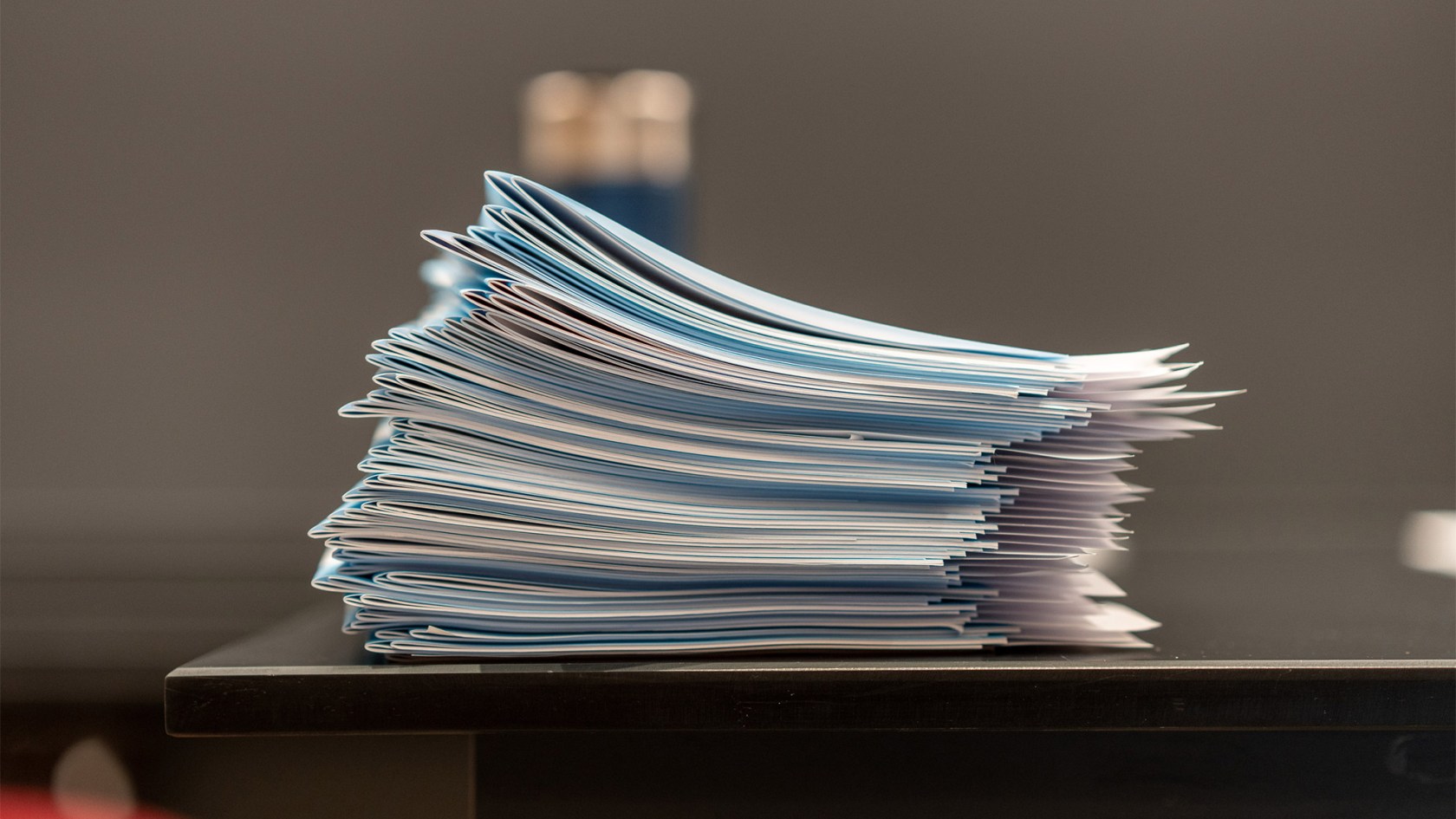 Stack of blue books.