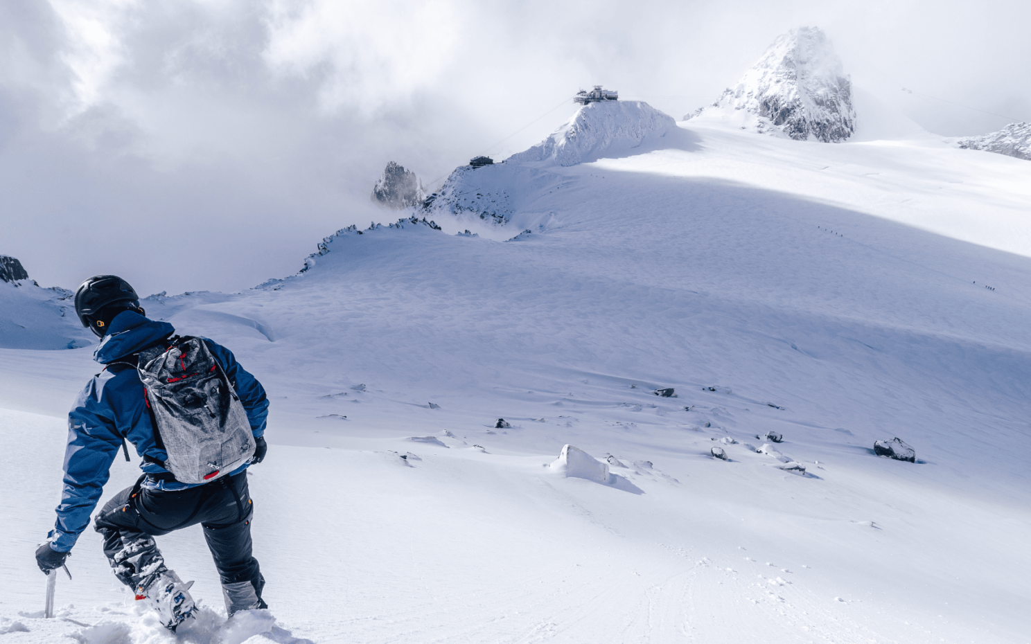 a person climbing a snowy mountain