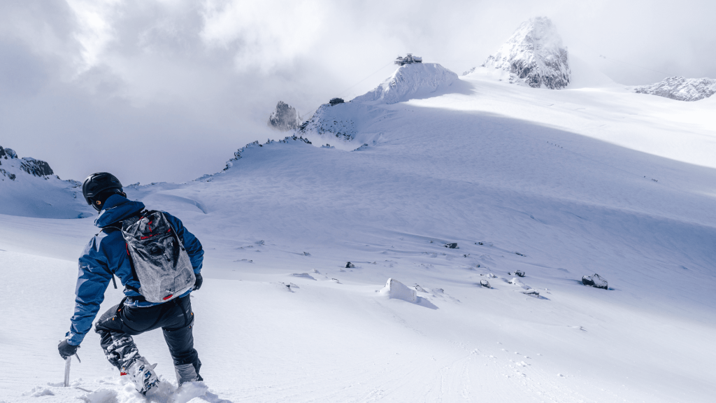 a person climbing a snowy mountain