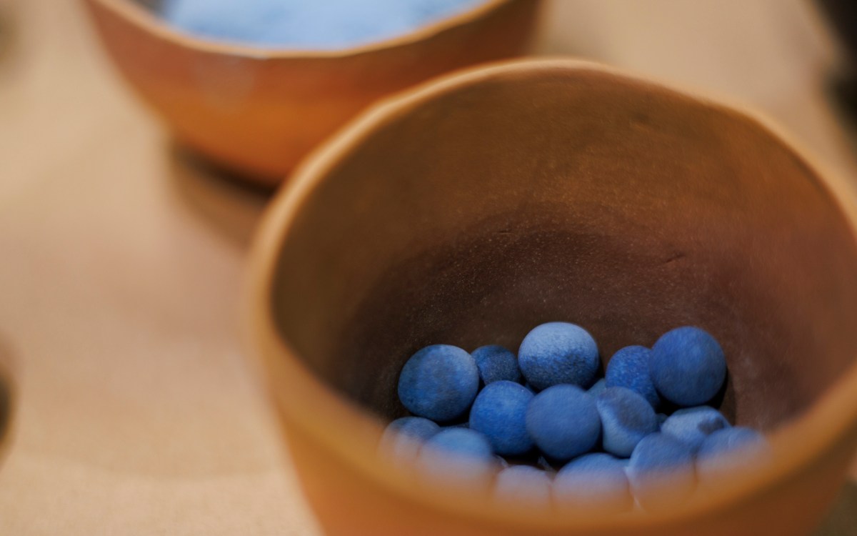 A pot of Egyptian Blue pigment pellets.
