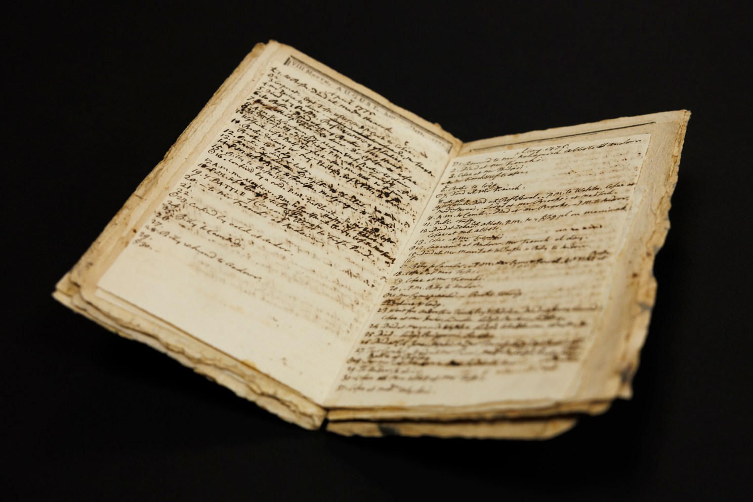 A photo of pages from John Winthrop’s 1775 annotated almanac