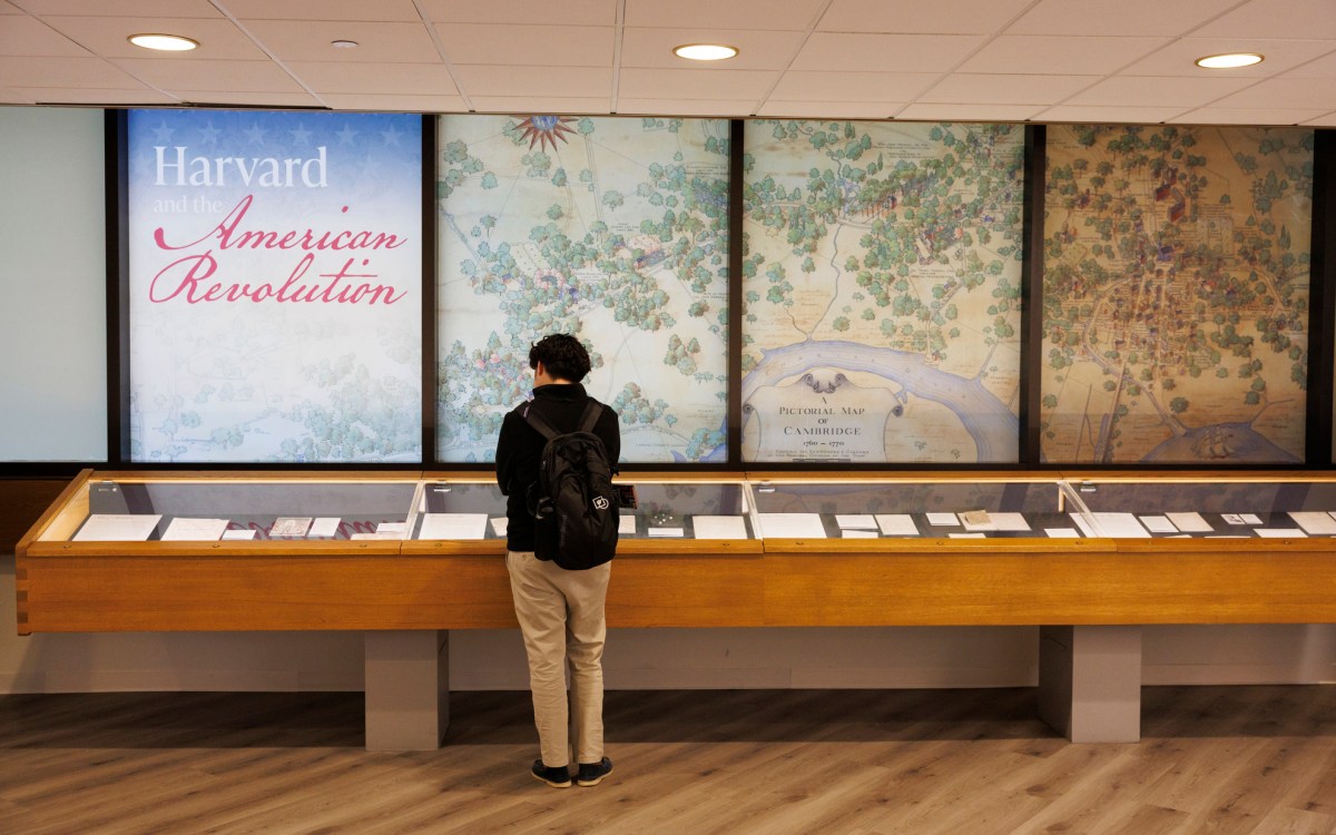 A visitor to the exhibit looks at materials on display.