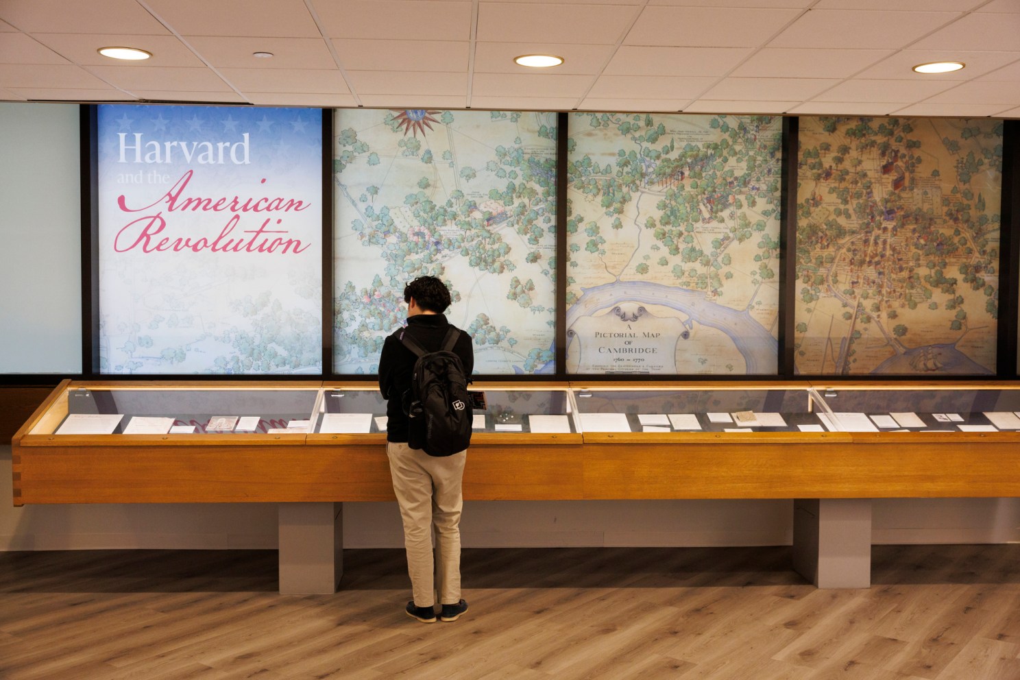 A visitor to the exhibit looks at materials on display.
