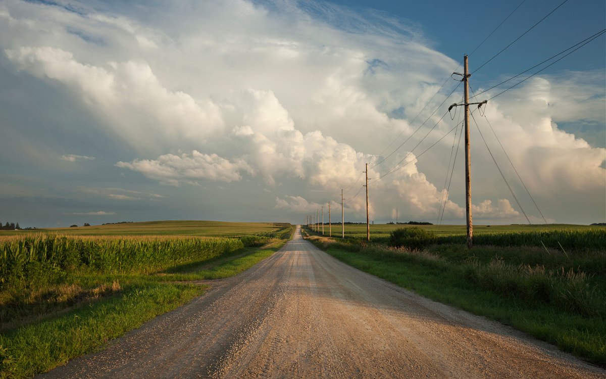 Rural road with dramatic clouds.