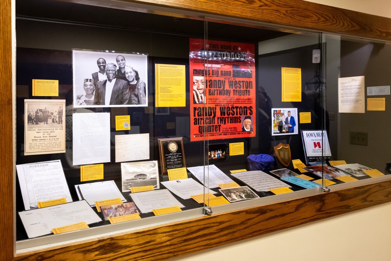 A display case from the Randy Weston exhibit at Loeb Music Library, with photos, posters, letters, news articles, and more.