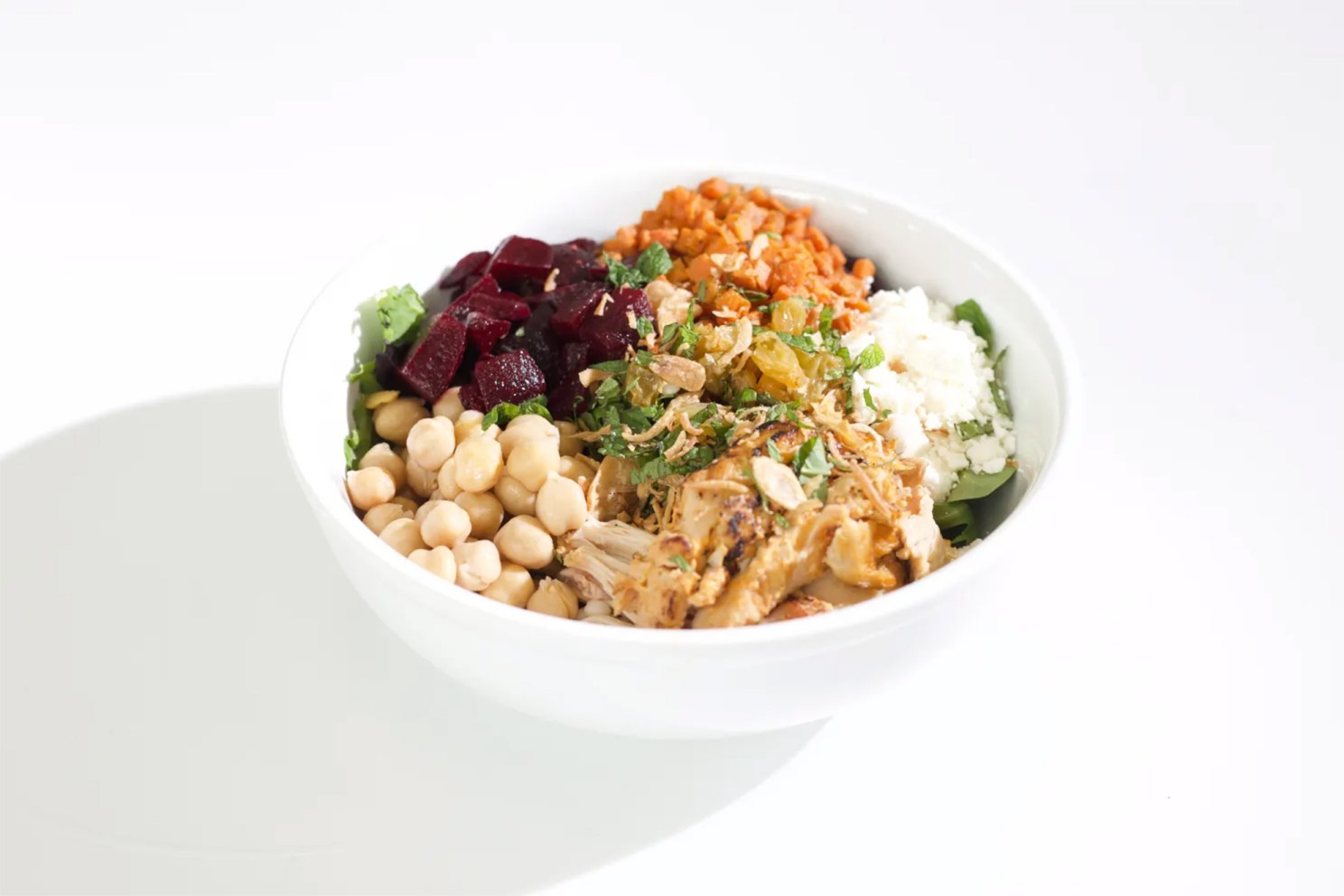 Green Restaurant Association points include credit for prioritizing local, organic, and plant-forward ingredients. Pictured is a bowl of beets, chickpeas, lentils, feta, and halal chicken from the SEC Cafe. Photos by Lora Morini
