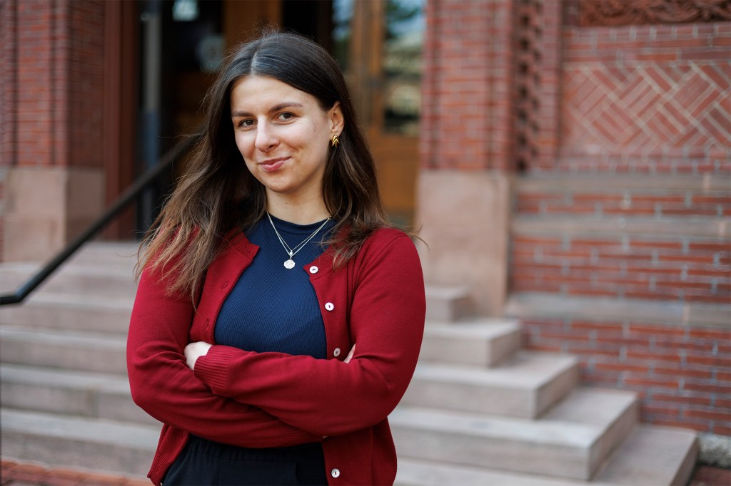 Portrait of Anastasiia Pereverten in front of Sever Hall.