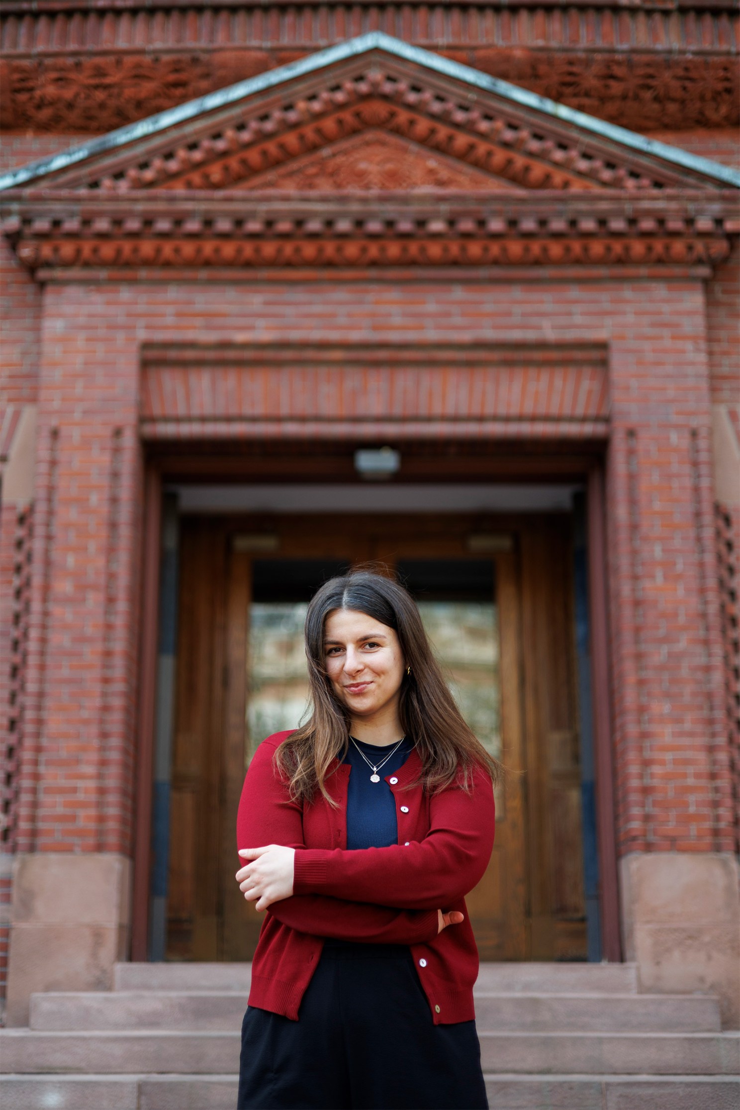 Portrait of Anastasiia Pereverten in front of Sever Hall.
