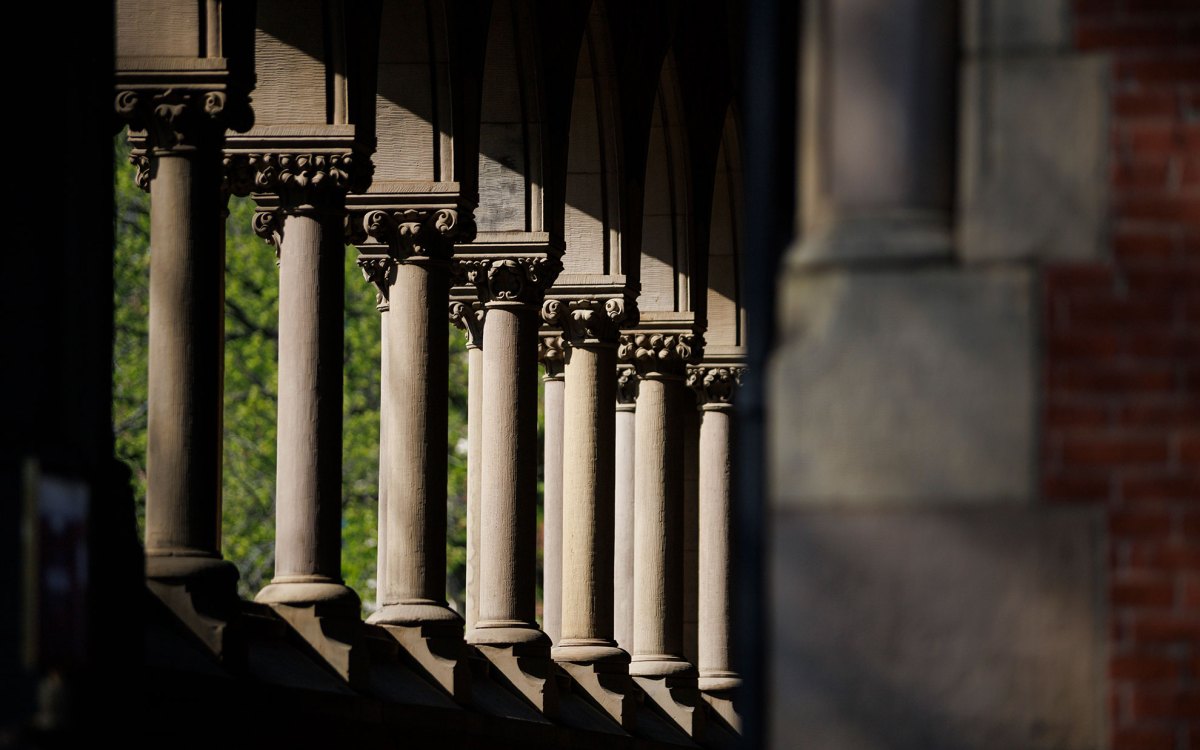 Sunlight beams through the columns of Memorial Hall.
