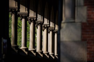 Sunlight beams through the columns of Memorial Hall.
