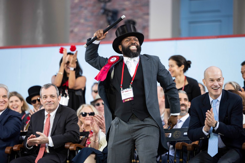 2024 Chief Marshal of the Alumni, Baratunde Thurston '99, reacts to his classmates in the crowd during Alumni Day.