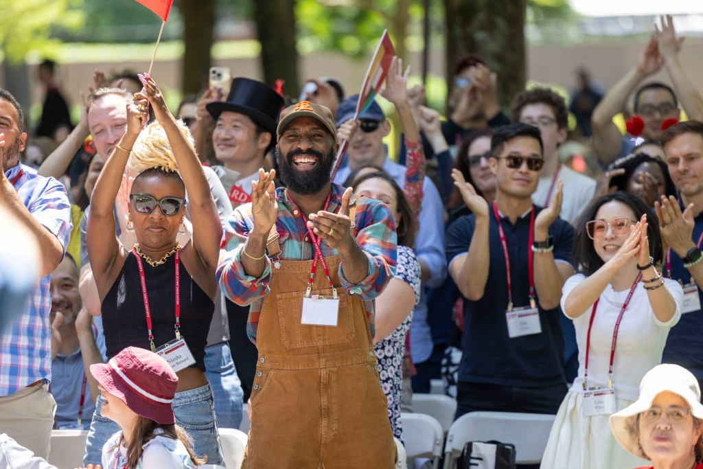 Members of the class of 1999 react to Chief Marshal, Baratunde Thurston '99 on Alumni Day, 2024.