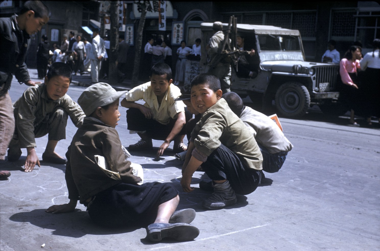 Boys play on a street in Pusan.
