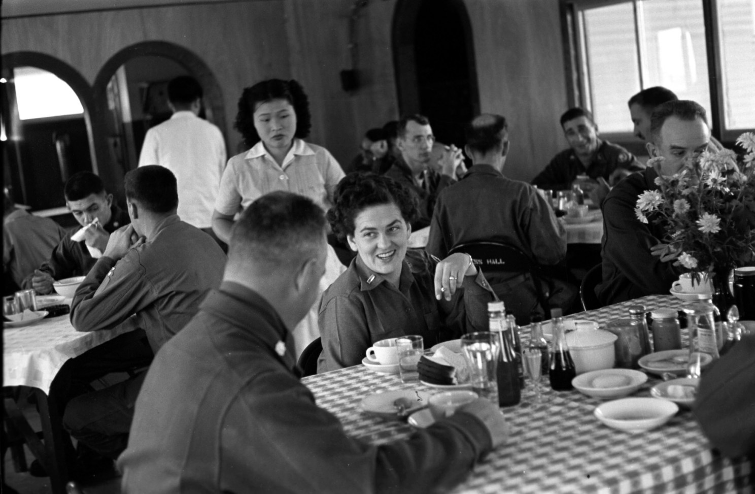 Officers eat at a mess hall.