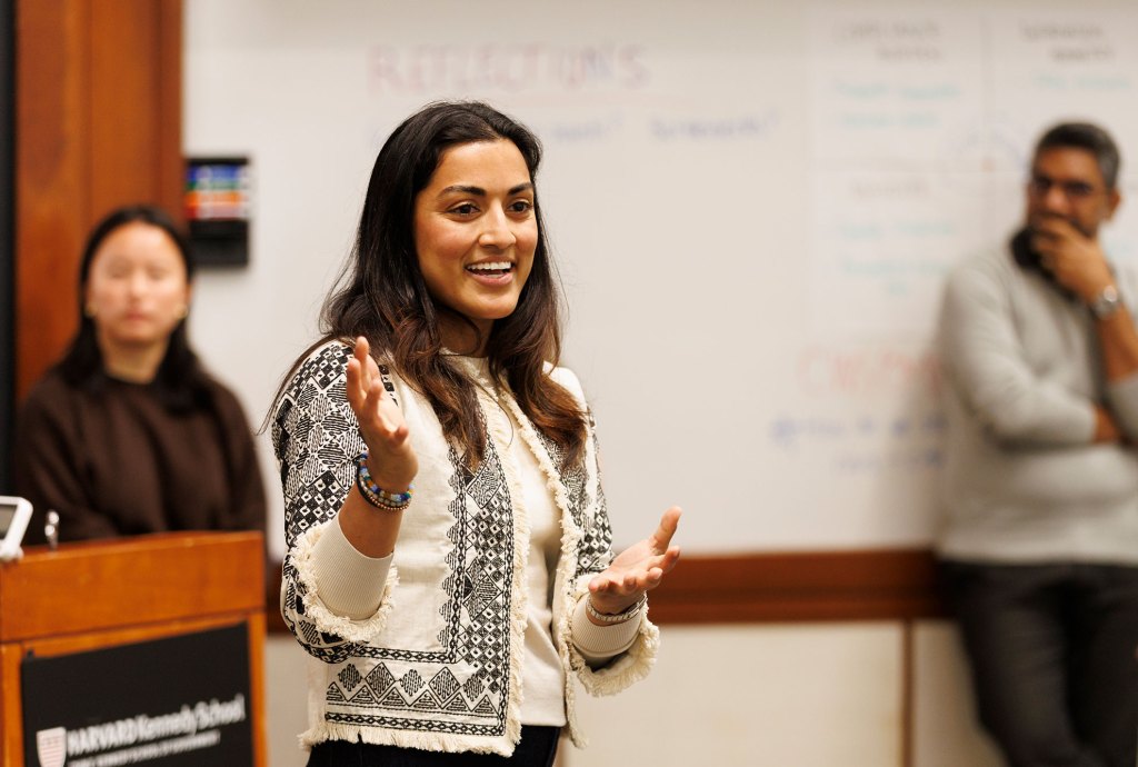 Ayushi Roy talking to student.