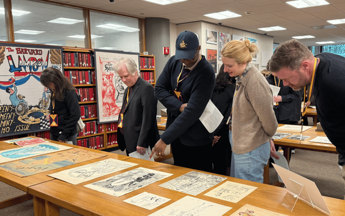 people looking at the Lampoon exhibit.