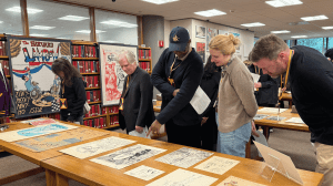 people looking at the Lampoon exhibit.