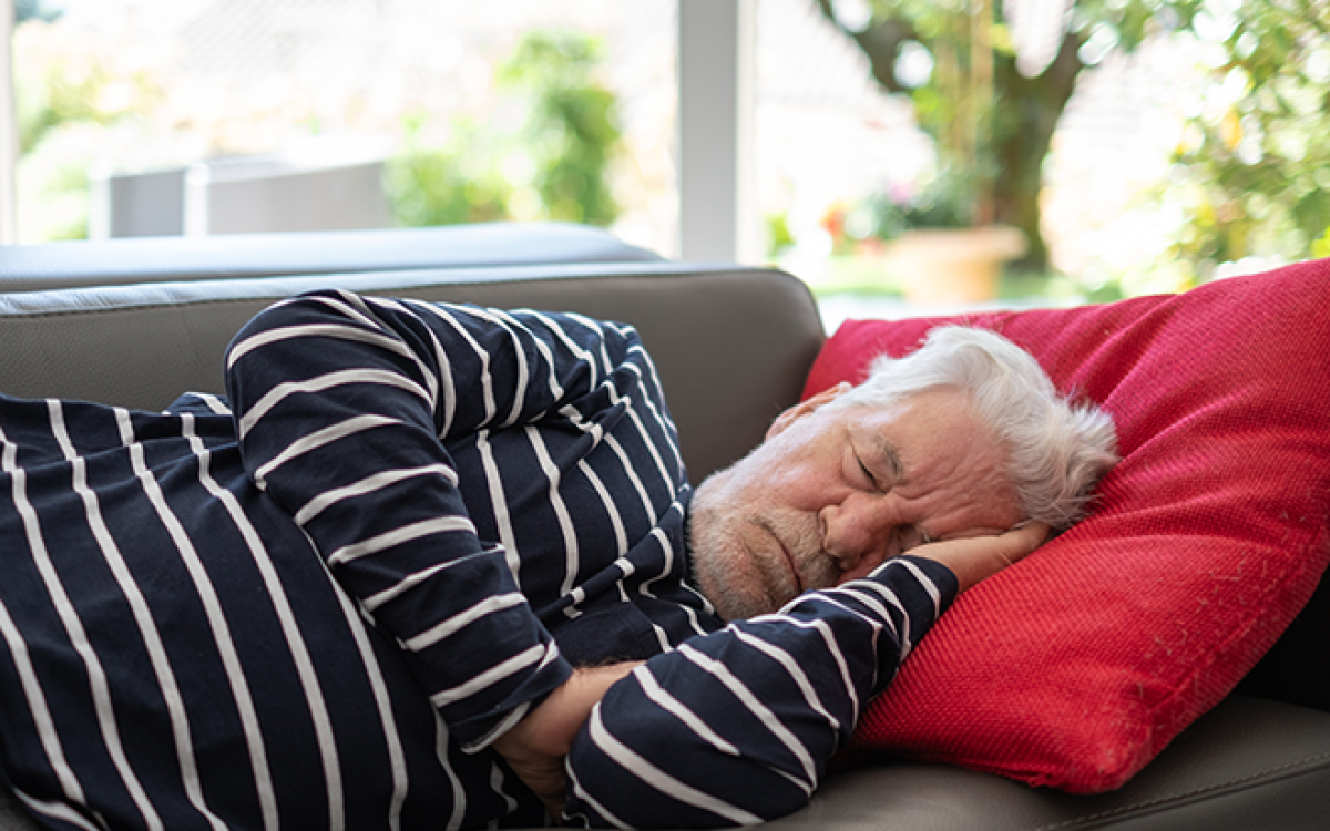 man napping on couch