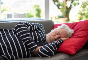 man napping on couch