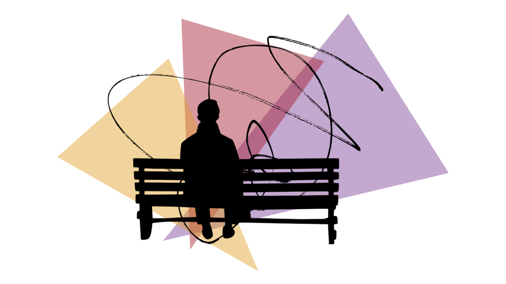 person sitting on a bench in contemplation