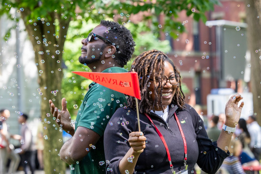 Harvard Alumni Day attendees enjoy the 360-degree photo booth at the Yard Party, 2024. 