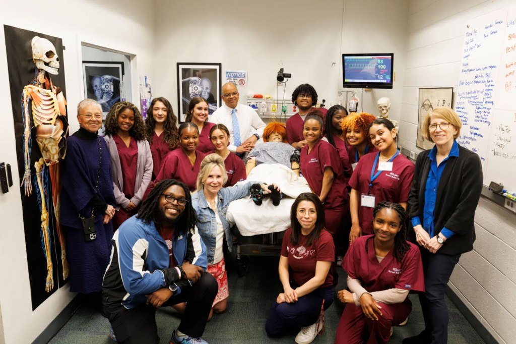 Boston Latin School students participating in the Harvard Medical School MEDscience program join MEDscience staff, Massachusetts Health & Human Services Secretary Kiame Mahaniah, and Massachusetts Assistant Secretary for Operational Effectiveness Joanne Marqusee.