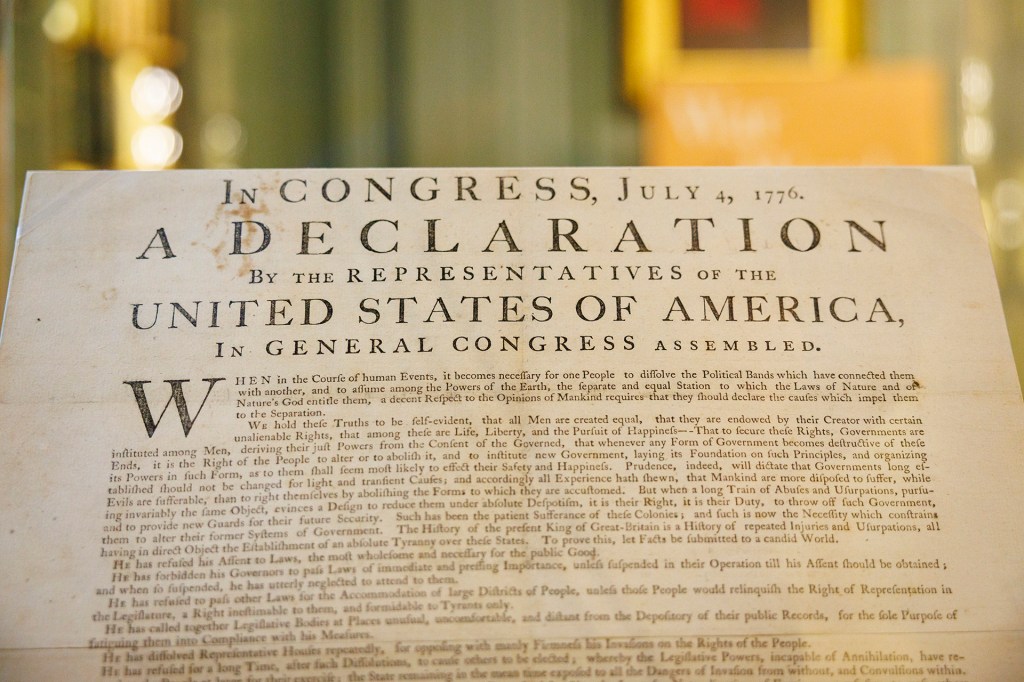 One of the first copies of the Declaration of Independence on display at Harvard.