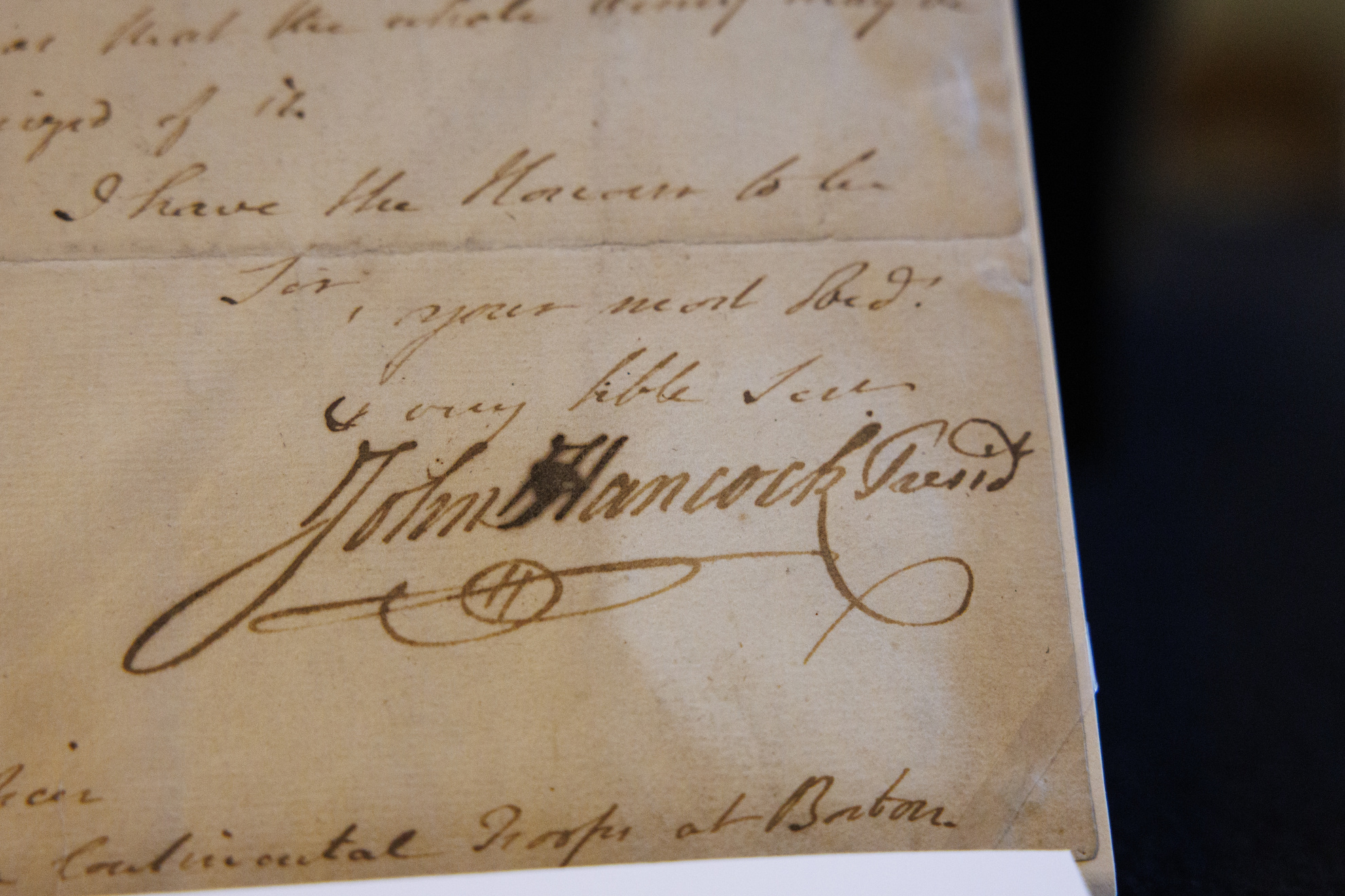 A photo of a document containing John Hancock's signature.