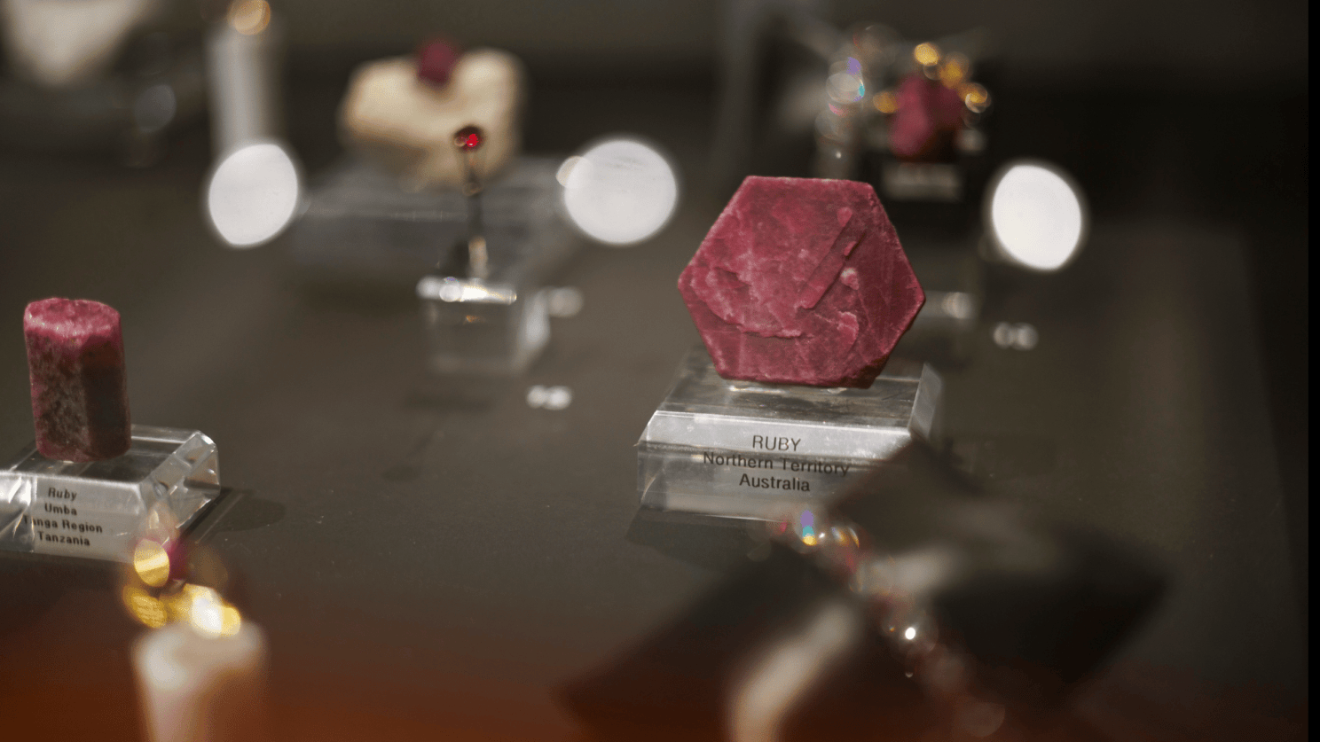 close up of rubies in a display case