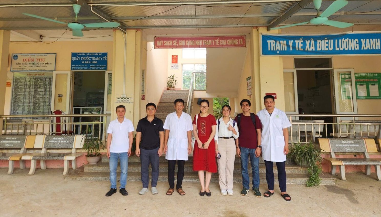 Picture of our students and their internship partners standing outside a building in Vietnam.