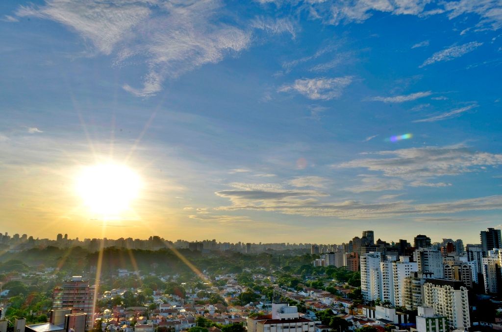 sun shining over a city