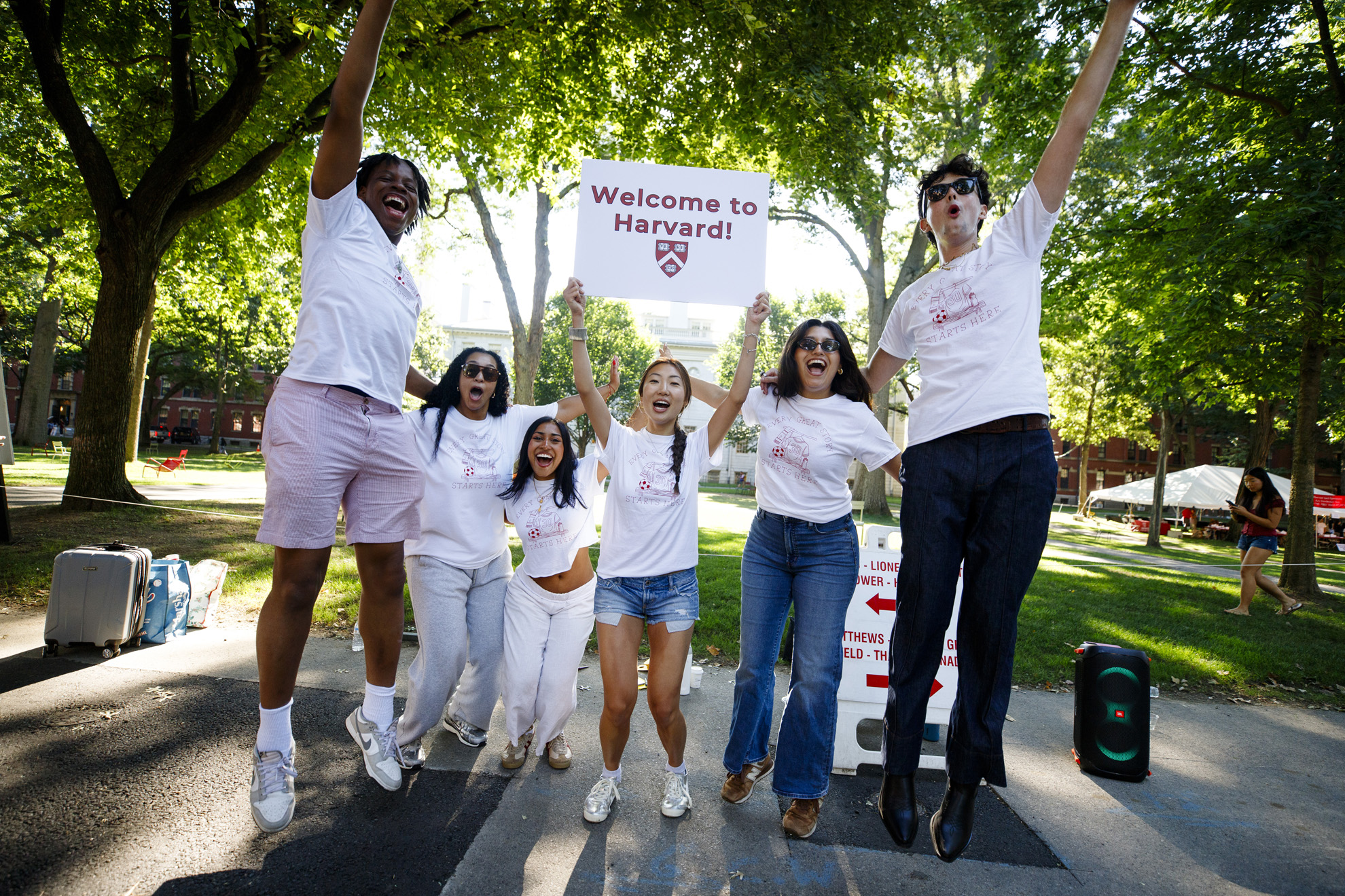 Members of the Crimson Key Society welcome first-year students to Harvard.