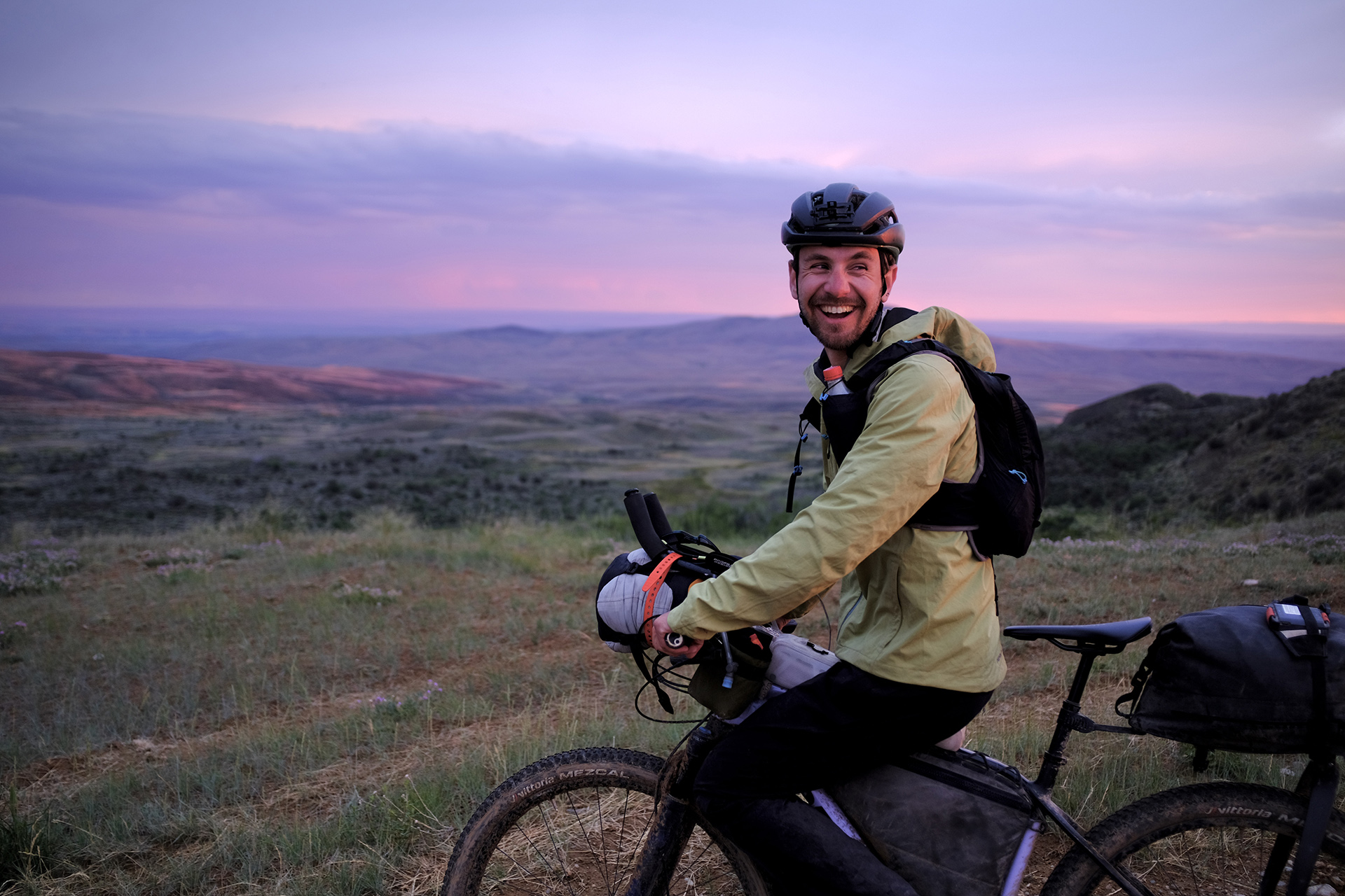 George Usmanov rides at sunset through southern Wyoming for the Tour Divide.