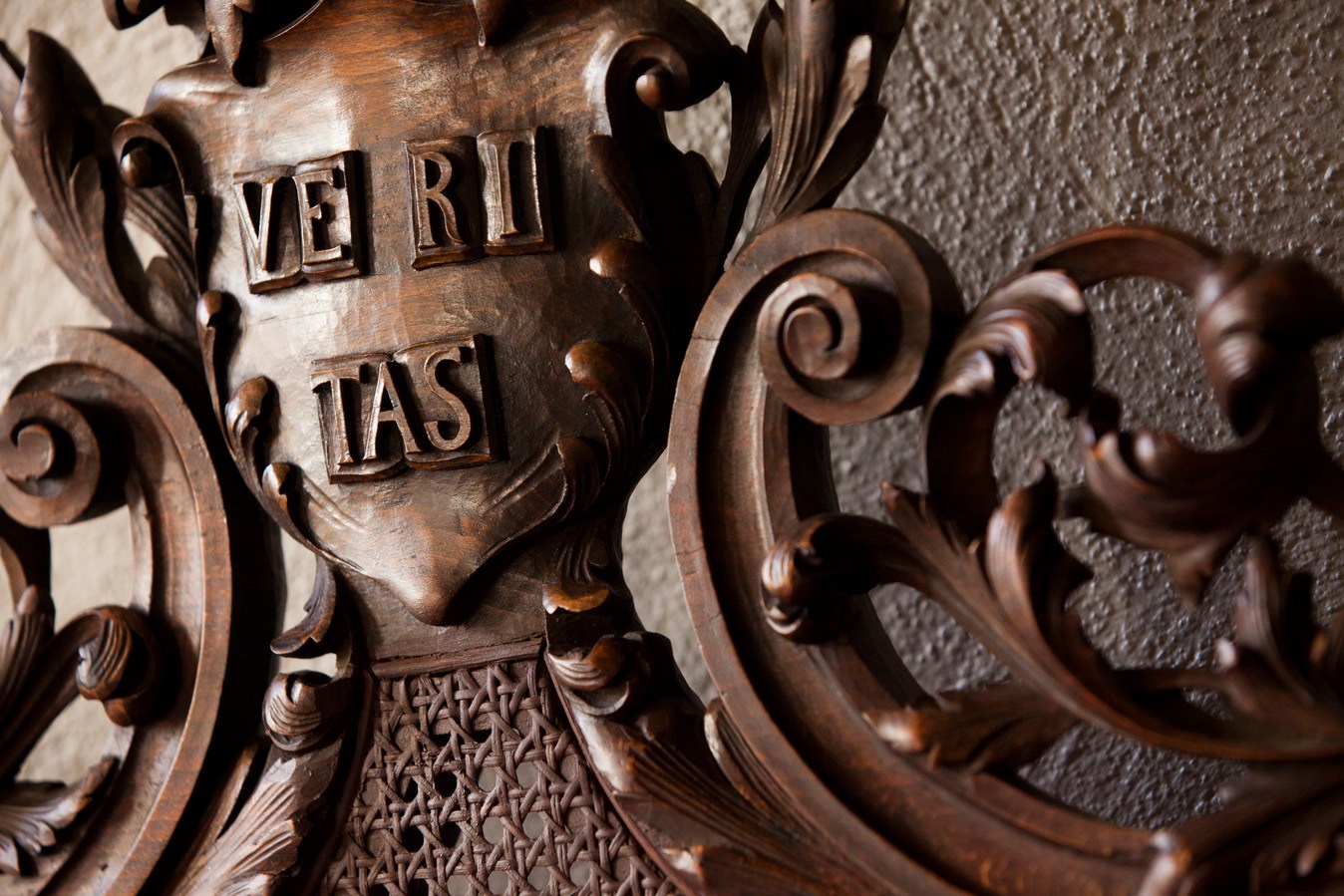 A veritas shield decorates a chair in the entrance way in Memorial Church at Harvard University.