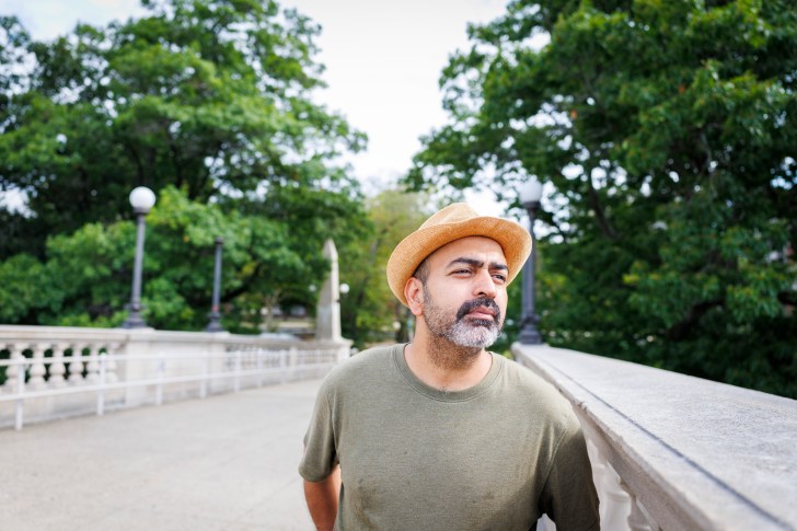 Leo Moradi stands on the Weeks Footbridge.